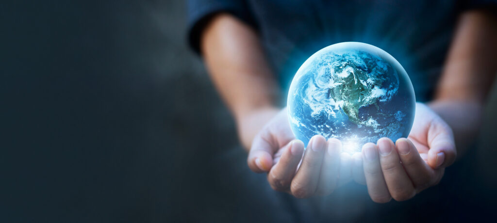 Hands holding a globe representing our international delivery services